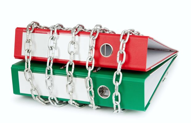 Two ring binders wrapped in a steel chain